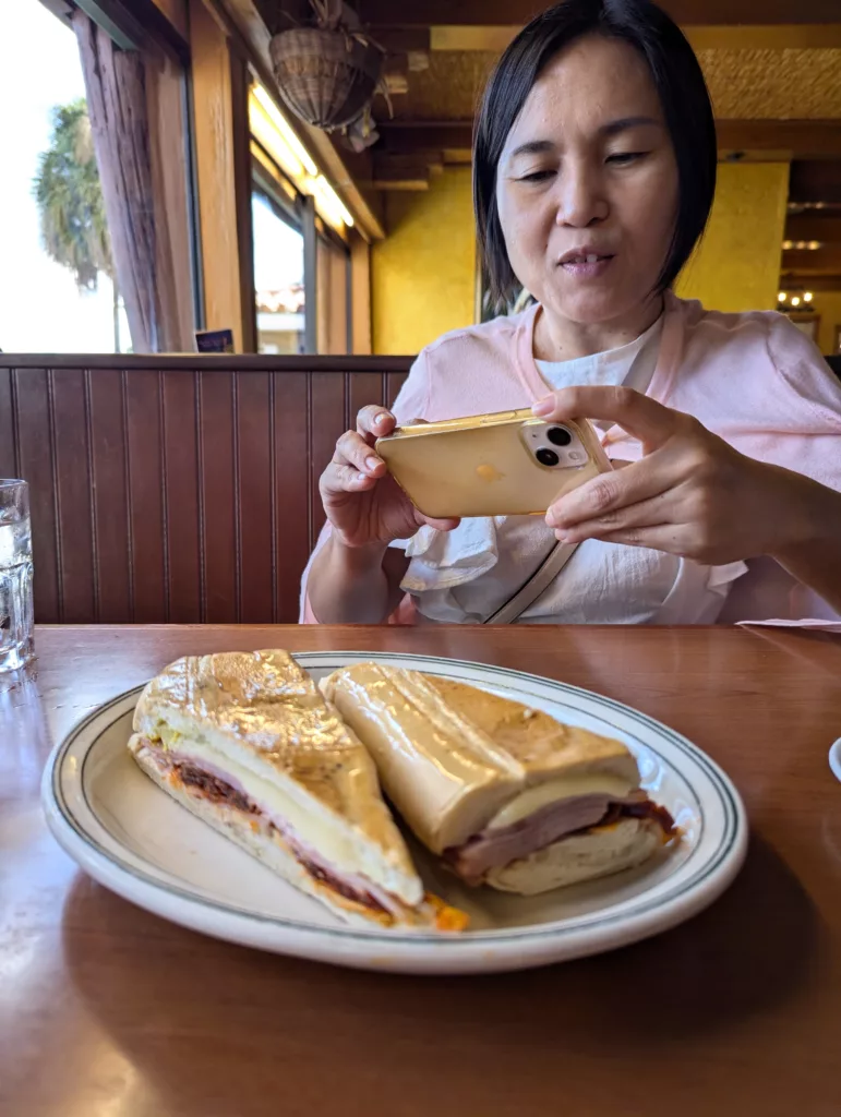 Sachie photographing a Cuban sandwich