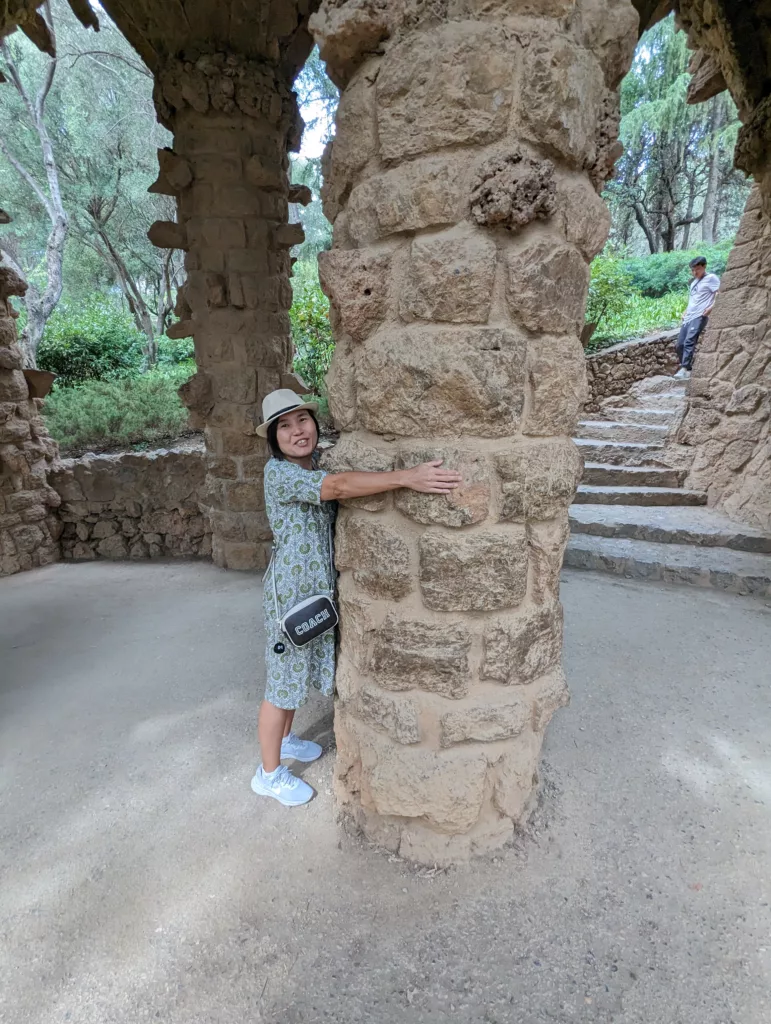 Sachie hugging a column