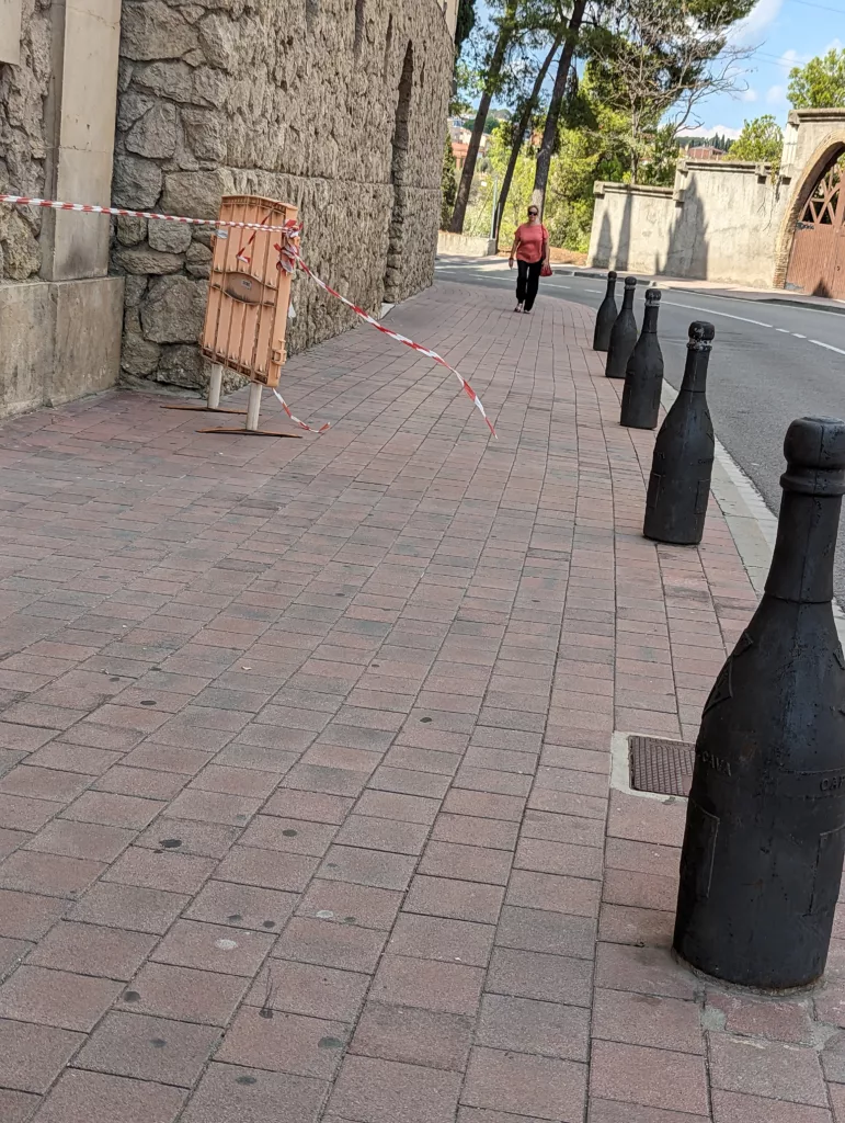 Pavement with wine-bottle shaped bollards