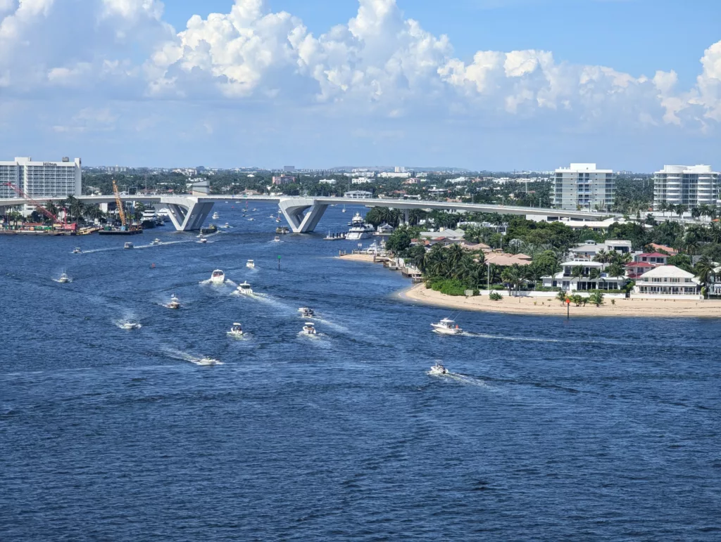 Inlet and bridge with many boats on a sunny day