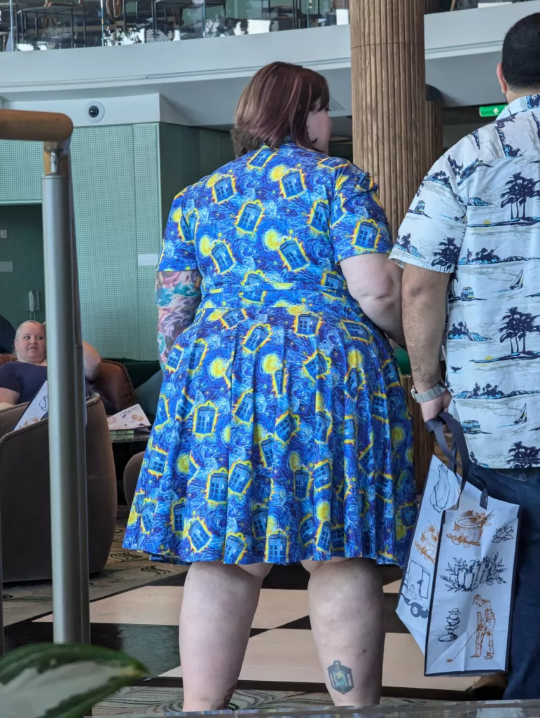 Large woman with Tardis print dress