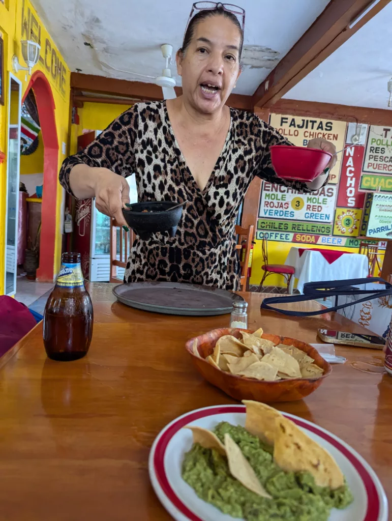 Middle aged Mexican lady serving food