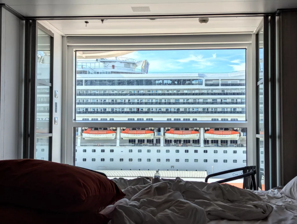 View out cabin window of liner opposite.