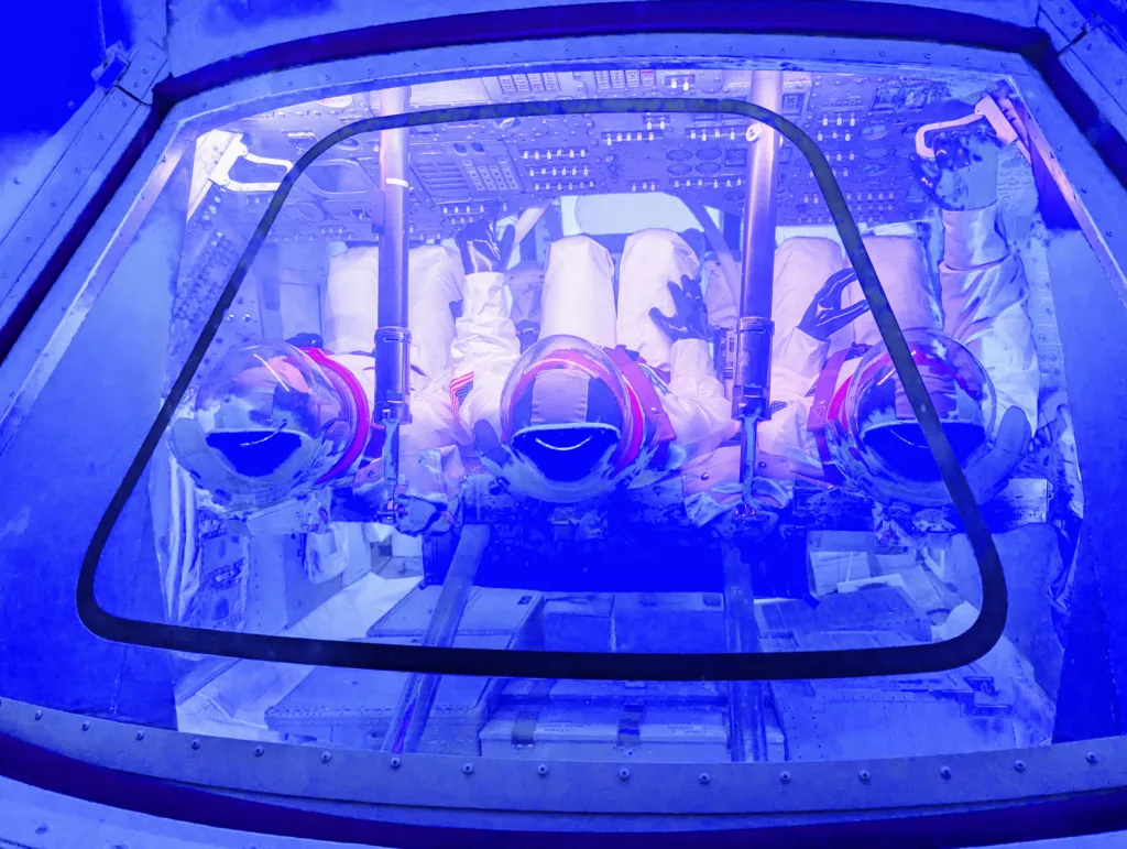 Astronauts in capsule