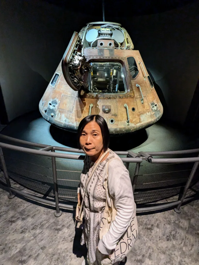 Sachie in front of reentry capsule
