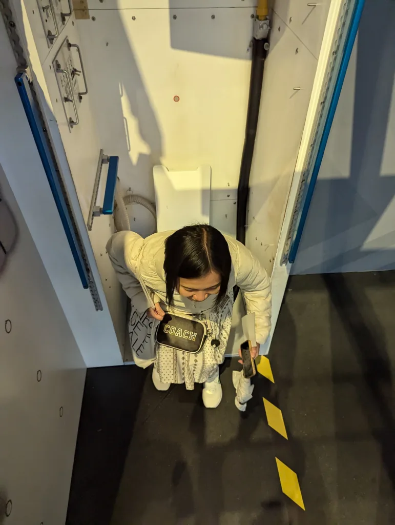 Sachie on shuttle toilet